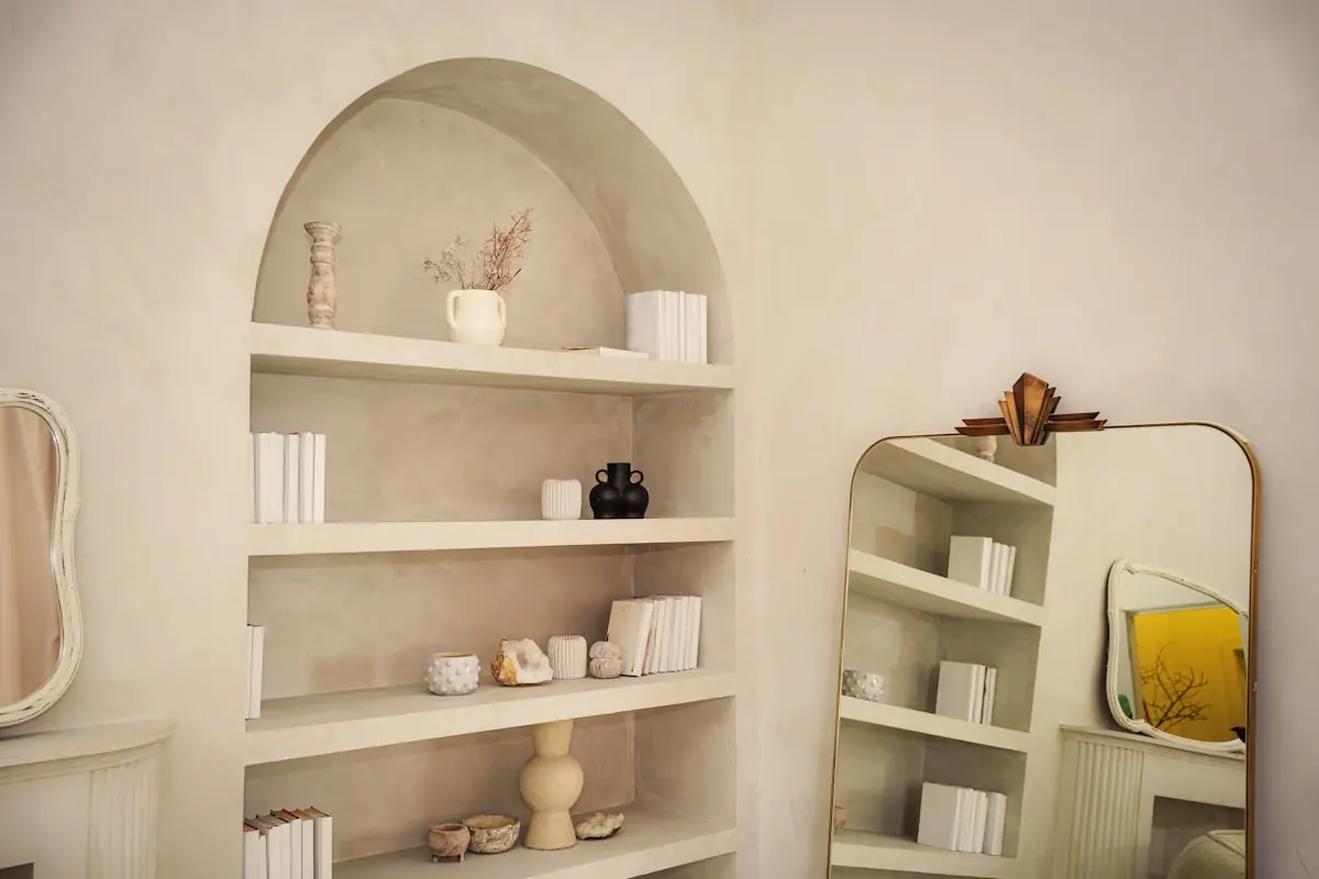 The Velora reception nook, softly lit with ceramics and folded linen