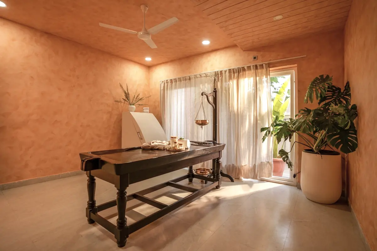 Private treatment room with a dressed table and warm plaster walls