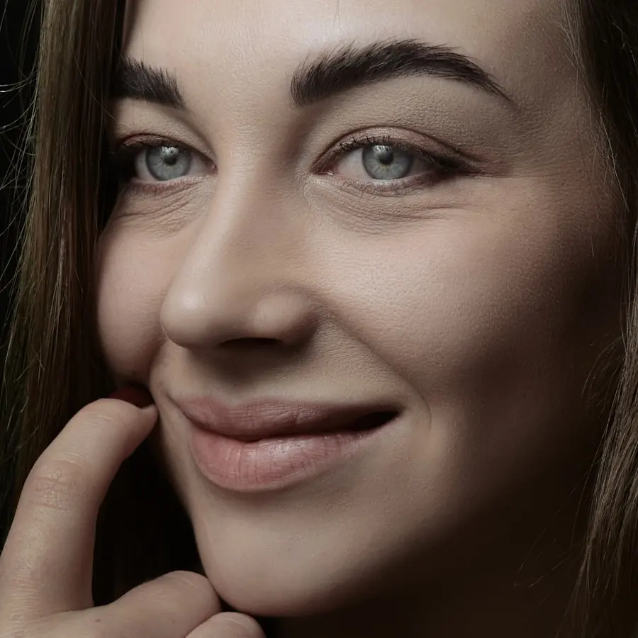 Woman smiling warmly with a fresh, natural complexion